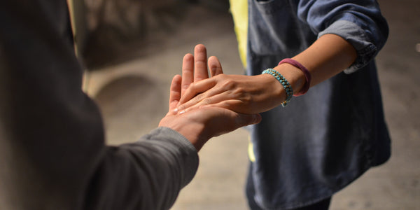 Helping hands holding hands reach out ask for help anxiety relief