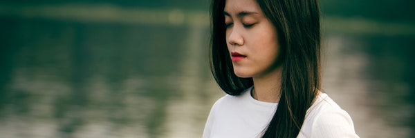 Woman breathing deeply calm meditating Entrainment body rhythm